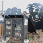 Photo by Bailey Jo Josie/Sound Publishing
The corner of the park heralds a metal statue inspired by the original Black Panther Party logo, reaching one paw out over a community food pantry (pictured) and the other paw reaching over a lending library.