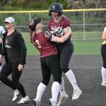 Ashlyn Trujillo gets lifted in the air by Jersie Wilton following the walkoff win. Ben Ray / The Reporter