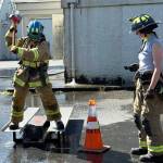 A woman swings a sledgehammer during a firefighting career workshop in Kent. COURTESY PHOTO, Puget Sound Fire