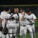 Kentlake players high-five following the win over Auburn Mountainview. Ben Ray / The Reporter