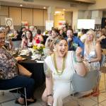 Raffle drawings were part of the fun at DAWNs annual May It Forward fundraising gala May 2 at Renton Technical College. Photo by Crain Photography