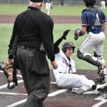 Matthew Ledbetter slides home for the Falcons. Ben Ray / The Reporter