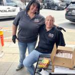Chandra and Randall Smith, of All Pro Building Maintenance, serve up a barbecue for officers. COURTESY PHOTO, Kent Police