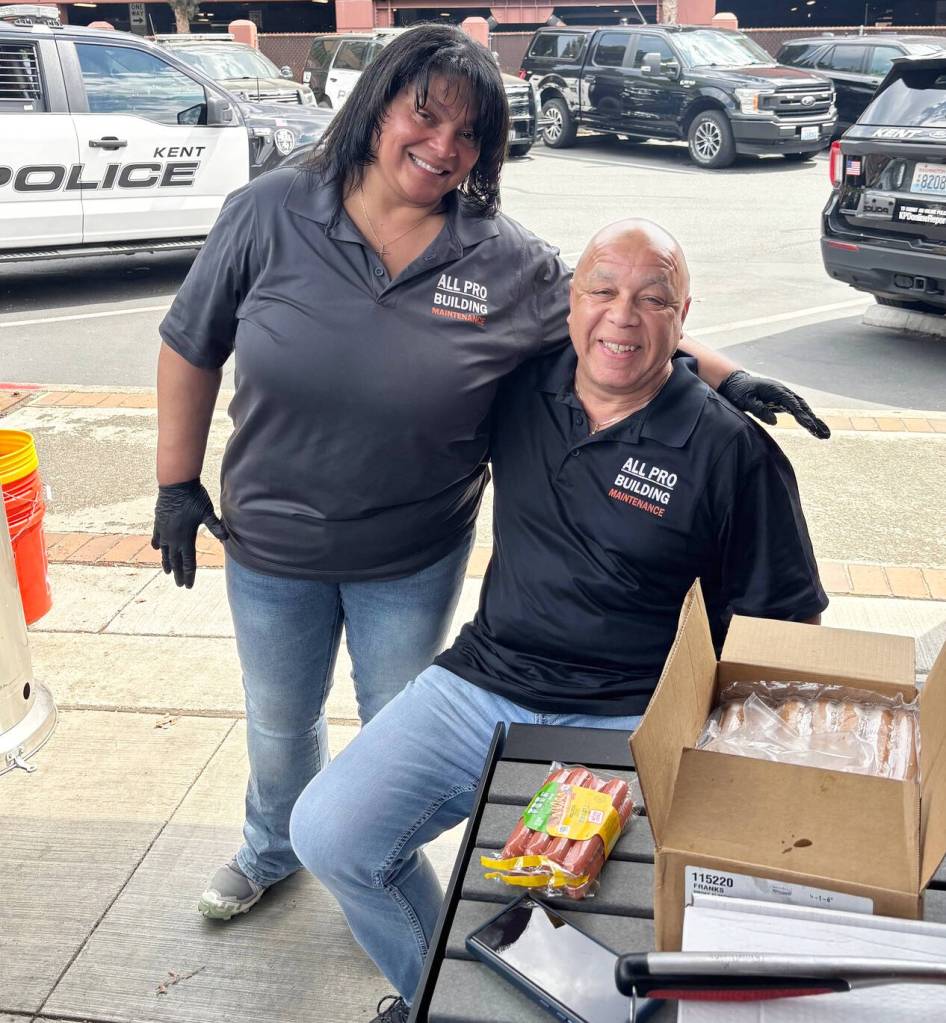 Chandra and Randall Smith, of All Pro Building Maintenance, serve up a barbecue for officers. COURTESY PHOTO, Kent Police