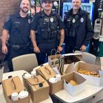 Officers check out the coffee and food from Starbucks and Wild Wheat Bakery. COURTESY PHOTO, Kent Police