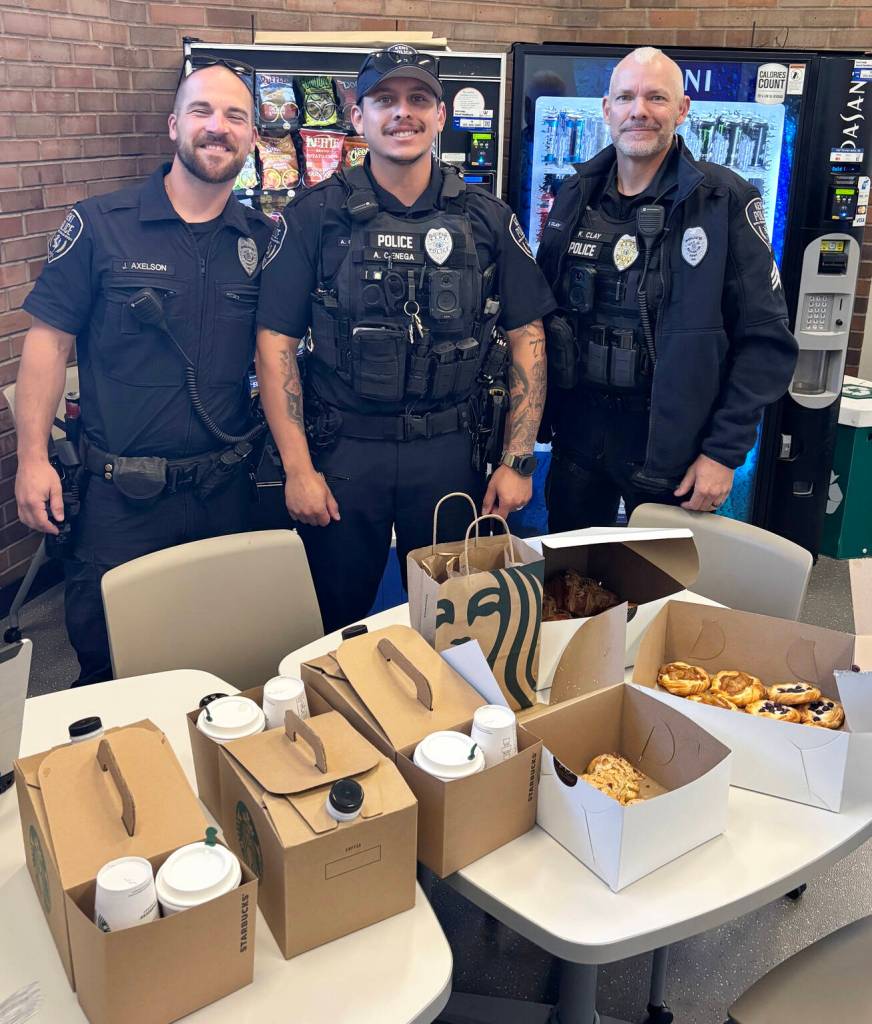 Officers check out the coffee and food from Starbucks and Wild Wheat Bakery. COURTESY PHOTO, Kent Police