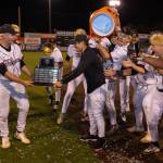 Mike Suguro and Christopher Moore hold the championship trophy. Photo provided by Robby Mullikin.