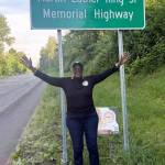 Gwen Allen-Carston displays her joy about the new sign. COURTESY PHOTO, Kent Black Action Commission