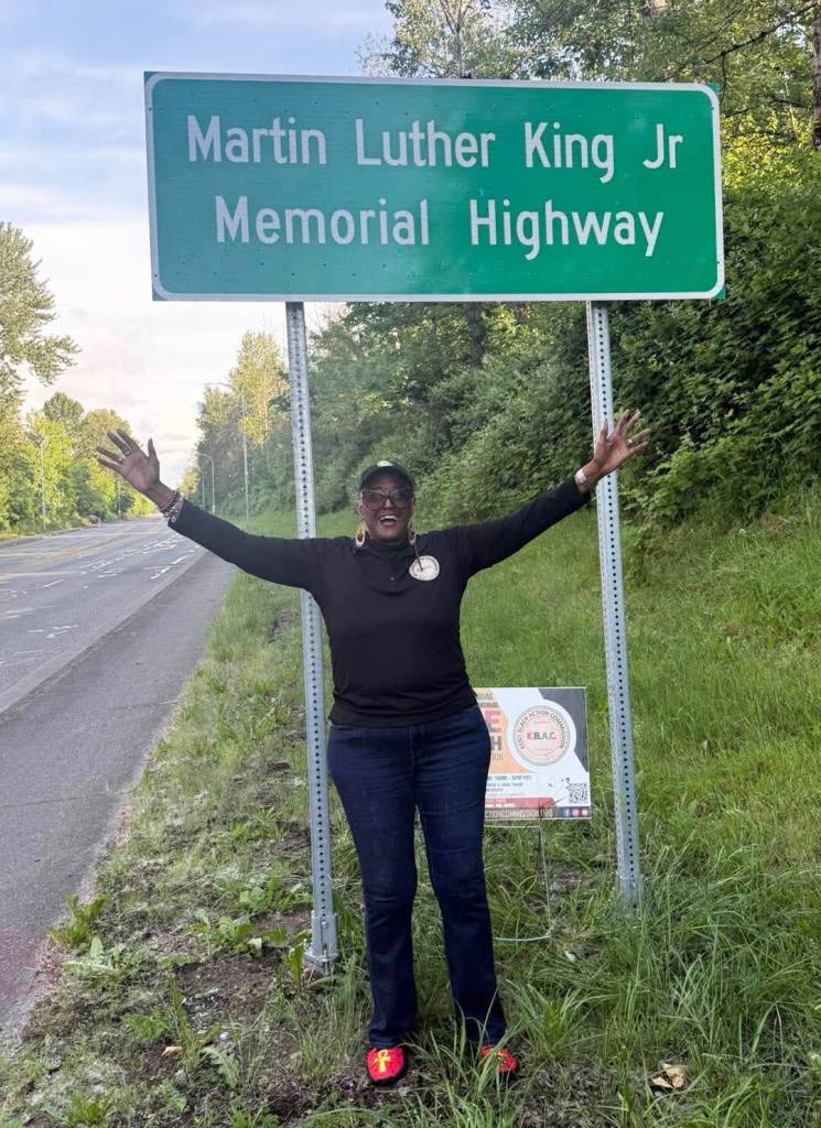 Gwen Allen-Carston displays her joy about the new sign. COURTESY PHOTO, Kent Black Action Commission