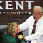 Les Thomas greets Kent Mayor Dana Ralph during his final City Council meeting in December 2023. STEVE HUNTER, Kent Reporter