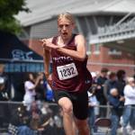 Theo Linstad runs up to the high jump for Kentlake. Ben Ray / Sound Publishing