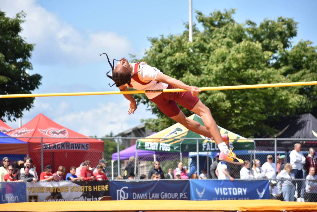 DJ Smith of Thomas Jefferson attempts to clear the bar of the high jump. Ben Ray / Sound Publishing