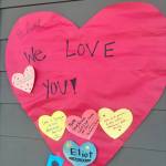 In the following photos, community members placed notes and flowers at a memorial for Eliot Abramson at the Mercer Island High School stadium. Staff photos by Andy Nystrom