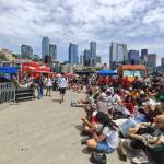 Fans sit and watch at Pier 62 as Belgium and Egypt play. Ben Ray / The Reporter
