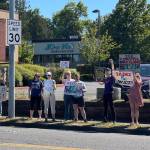 People line up along 104th Avenue SE in Kent to oppose ICE arrests. COURTESY PHOTO, Indivisible Covington/Kent