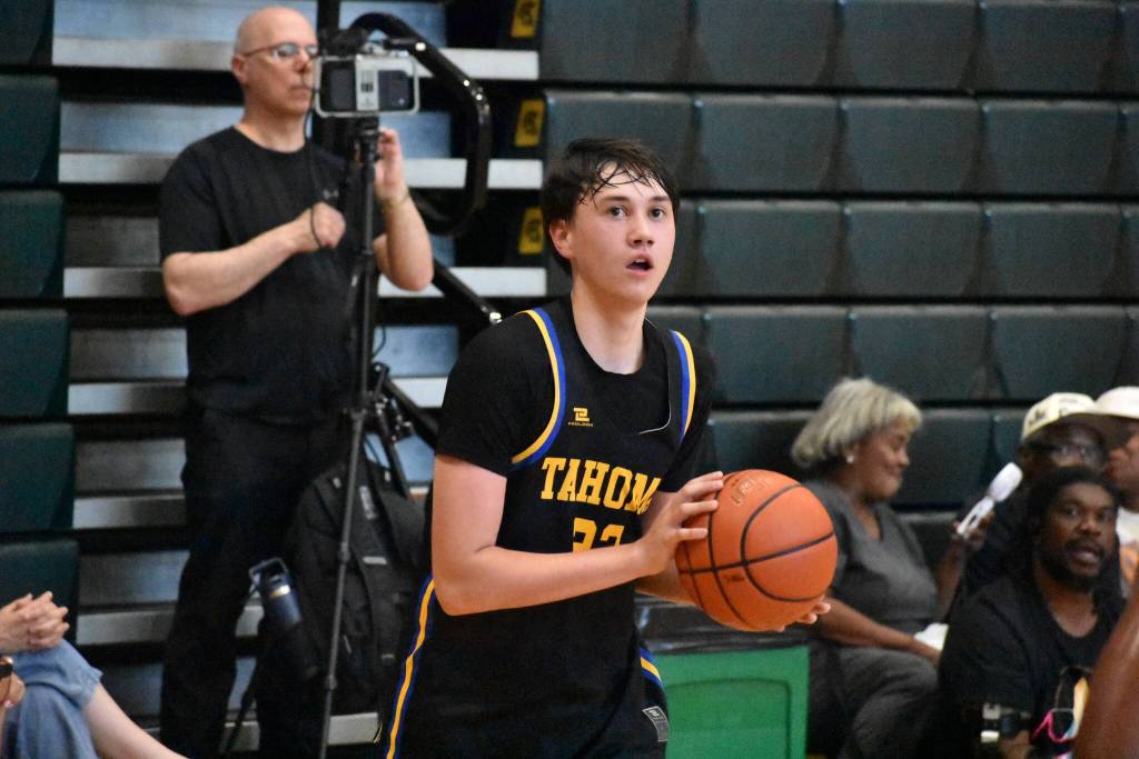 Tahomas Trevor Stonerock takes aim on a 3-point shot attempt. Ben Ray / The Reporter