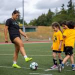 Kentridge players work with the campers during a drill. Photo provided by Eric Todd.