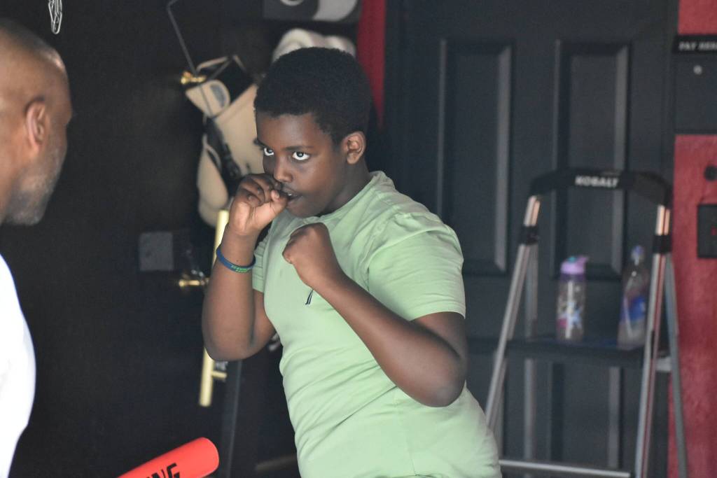 A boxer focuses on his target during a drill. Ben Ray / The Reporter