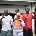 Mike Kelley (left) stands with three of his students at Beyond The Bell Mentorship and Boxing Club. Ben Ray / The Reporter