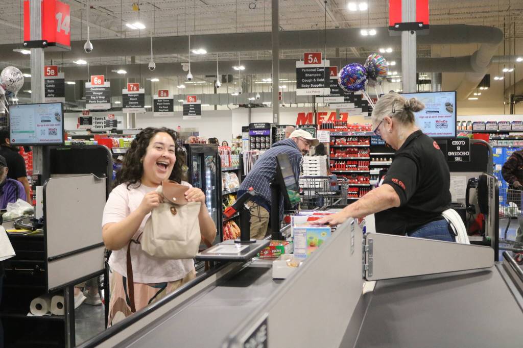 Some of the first few hundred customers to use the brand new WinCo checkout lanes. Photo by Bailey Jo Josie/Sound Publishing.